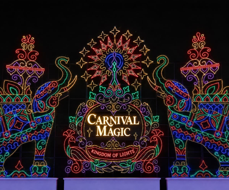 Carnival Magic illuminated at night, one of the best experiences in Phuket