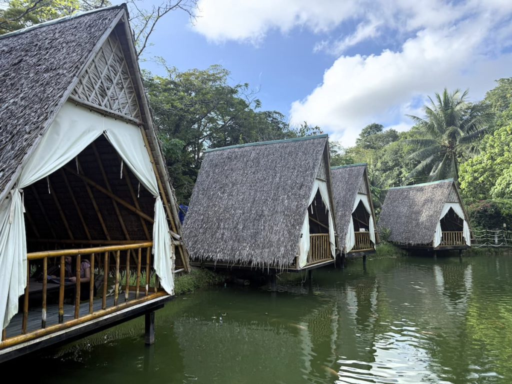 Thatched waterside dining huts at Lob Mhum Patong restaurant