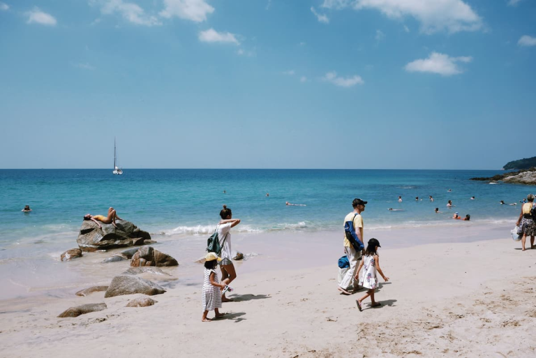 Family with children enjoying a tropical beach in Phuket, Thailand