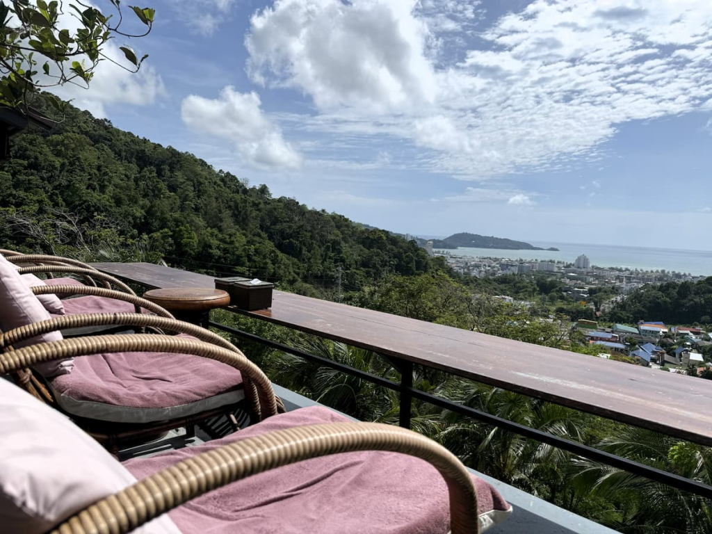 Terrace seating overlooking Patong town and Patong Bay from Pensook View Cafe in Phuket.