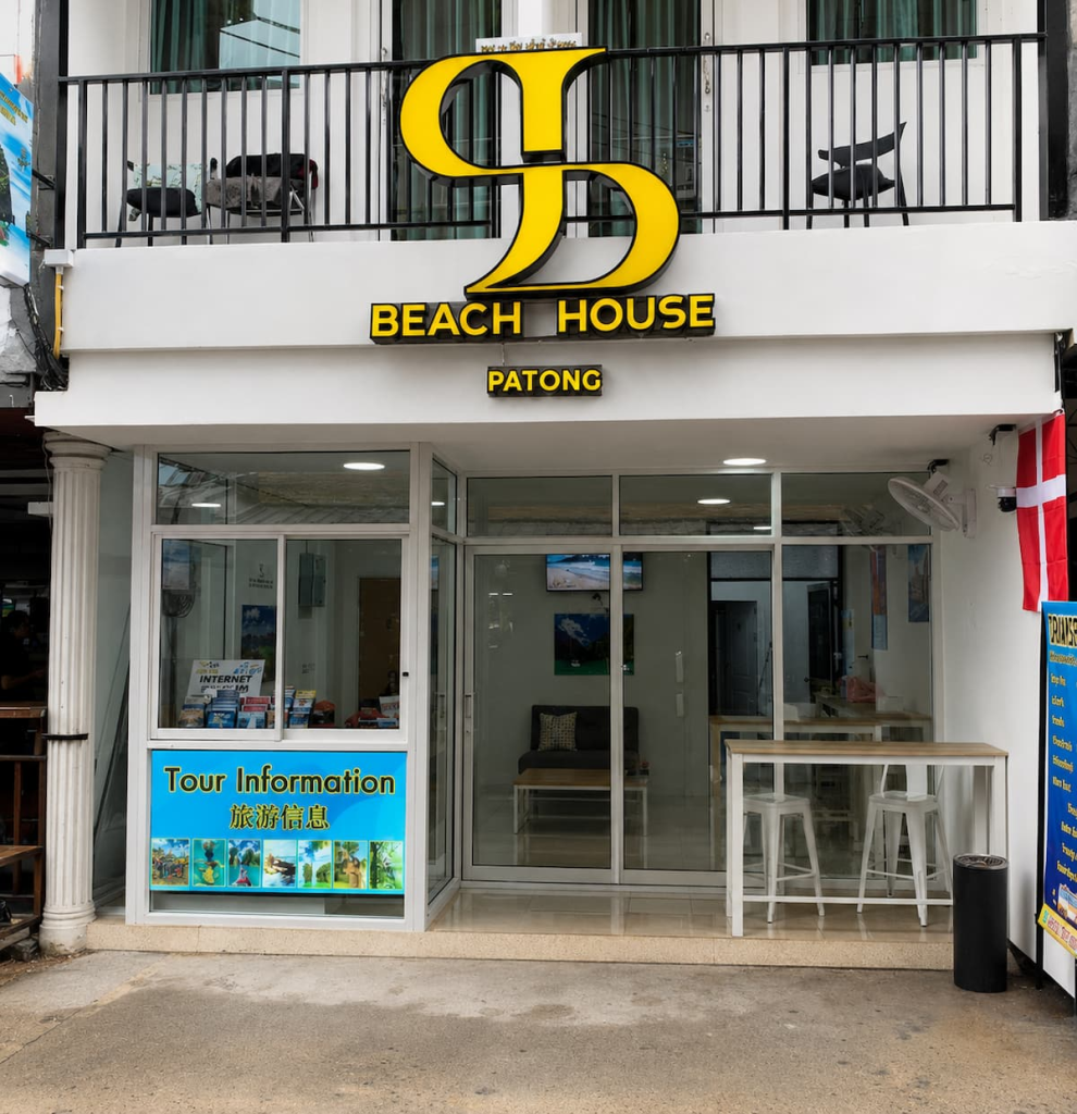 Street entrance and reception area of SJ Beach House Patong, a budget guesthouse near Patong Beach.