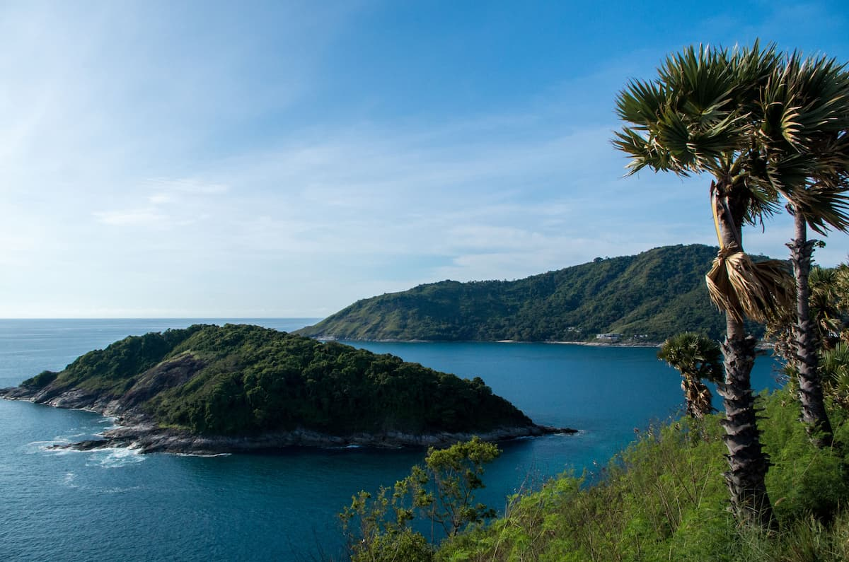 Travel to Phuket with tropical coastline, blue sea and palm trees overlooking the Andaman Sea